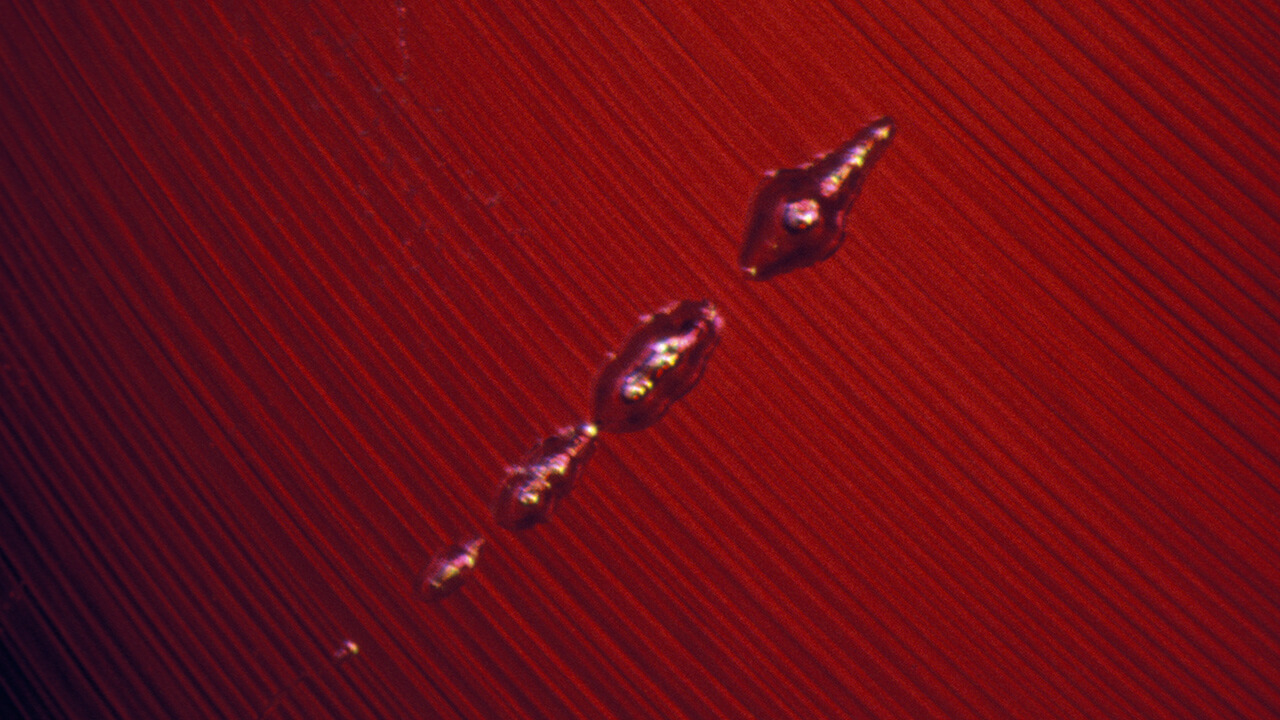 Gas Bubbles and Curved Striae The larval-shaped gas bubbles and curved striae (or parallel lines) would not be seen in natural rubies. This occurs in synthetic rubies made by the flame-fusion process. Photo by John I. Koivula/GIA Gas Bubbles and Curved Striae The larval-shaped gas bubbles and curved striae (or parallel lines) would not be seen in natural rubies. This occurs in synthetic rubies made by the flame-fusion process. Photo by John I. Koivula/GIA